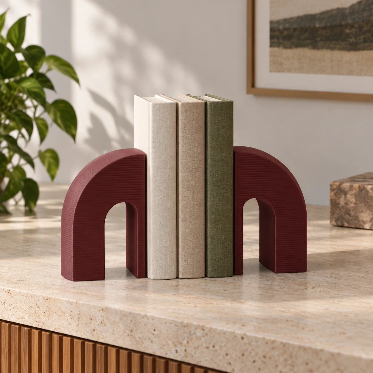 Burgundy arch bookends framing favorite books.